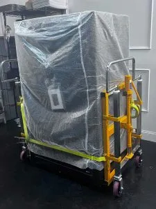 large safe getting delivered on a safe dolly
