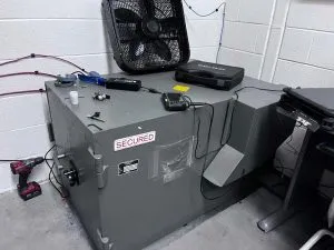 locksmith tools on a safe a technician is working on